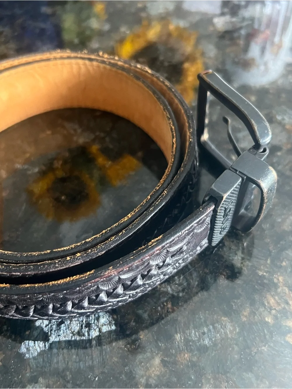 Vintage Levi's black tooled leather western belt with rotating harness buckle